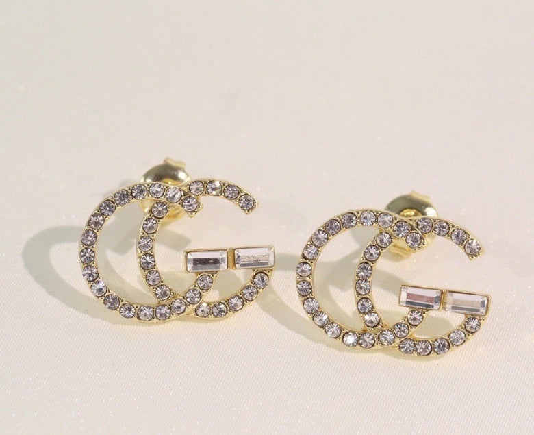 GE104 classic logo earrings with diamonds, simple and versatile