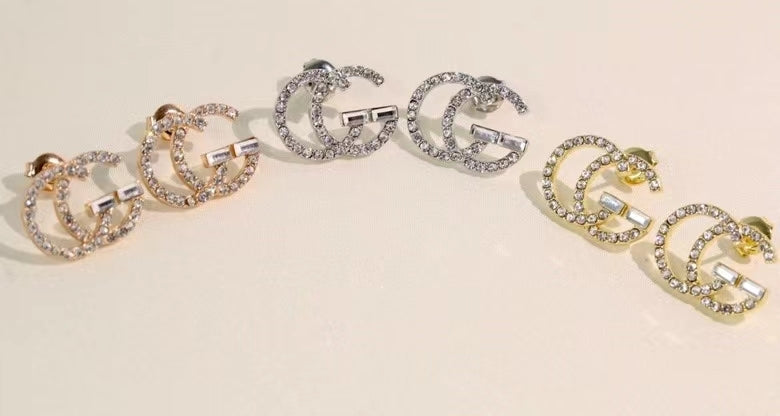 GE104 classic logo earrings with diamonds, simple and versatile
